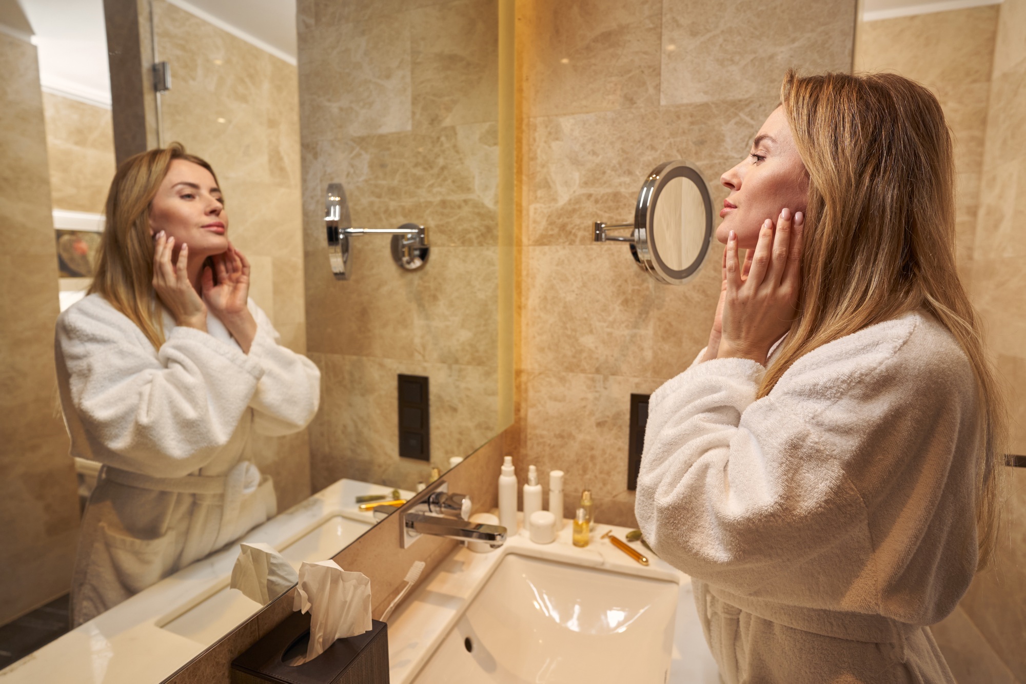 Young lady indulging in self-care during morning at hotel